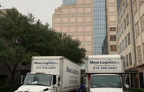 Image of Move Logistics moving trucks parked outside a commercial building