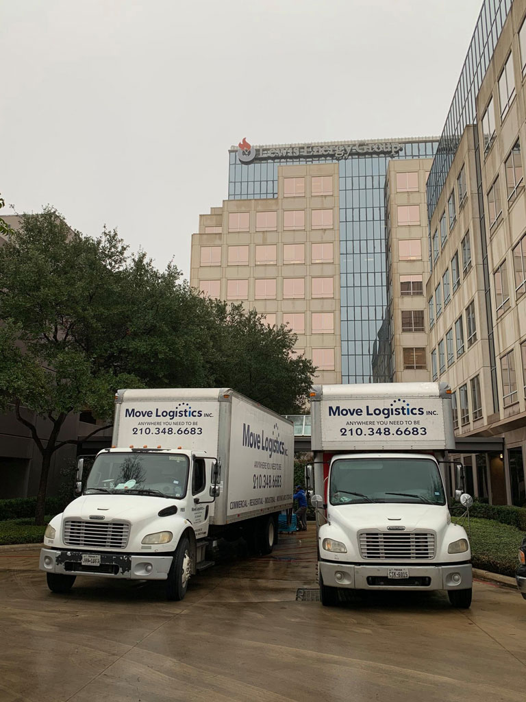 Image of Move Logistics moving trucks parked outside a commercial building