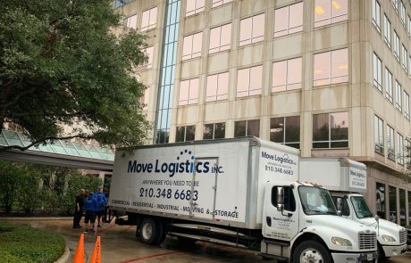 Image of a Move Logistics moving truck parked outside a commercial building