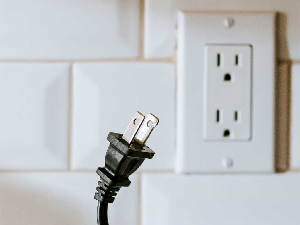 Image of a plug and wall socket