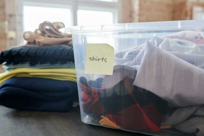 Image of a plastic storage bin with clothing inside