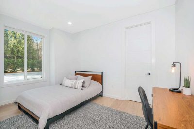 Image of a room with a bed and desk